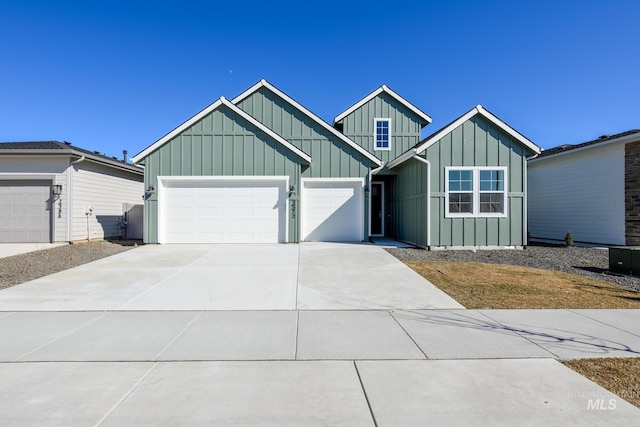 2372 N Leatherwood Ave, Star, ID 83669 - view of front of house with board and batten siding, an attached garage, and concrete driveway