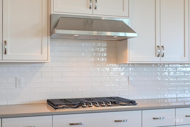 2372 N Leatherwood Ave, Star, ID 83669 - kitchen featuring wall chimney exhaust hood, stainless steel gas cooktop, white cabinets, and light countertops