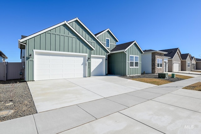 2372 N Leatherwood Ave, Star, ID 83669 - view of front of property featuring board and batten siding, a garage, and driveway