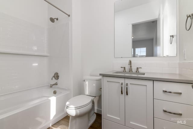 2372 N Leatherwood Ave, Star, ID 83669 - bathroom with vanity, toilet, bathtub / shower combination, and wood finished floors