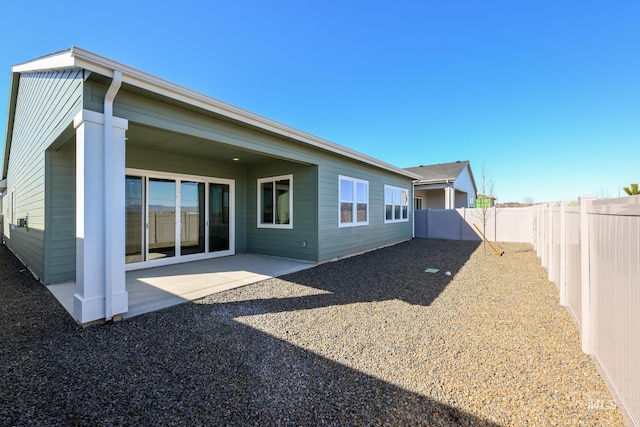 2372 N Leatherwood Ave, Star, ID 83669 - back of house featuring a fenced backyard and a patio area