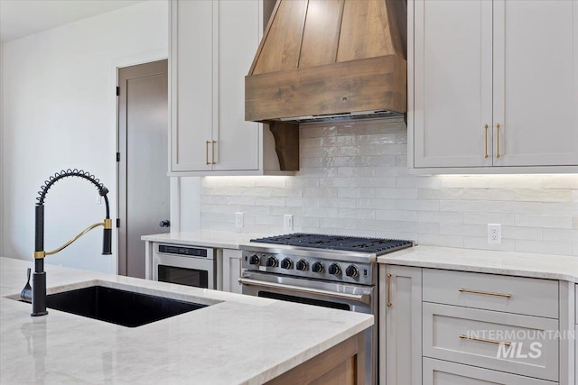 1967 Red Rock Way, Twin Falls, ID 83301 - kitchen with premium range hood, high end stove, backsplash, and light stone counters