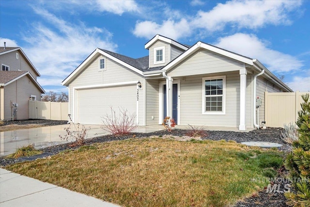 view of front of property with a garage and a front lawn