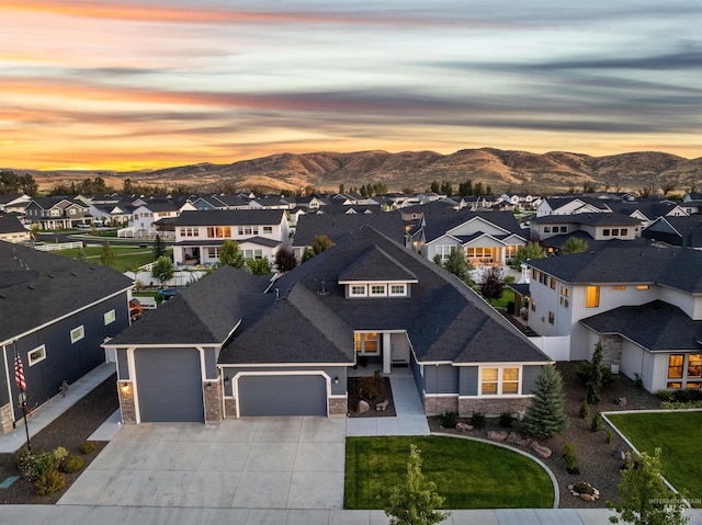 view of front of property featuring a mountain view and a garage