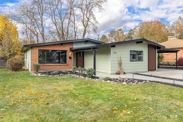 single story home with a carport and a front lawn