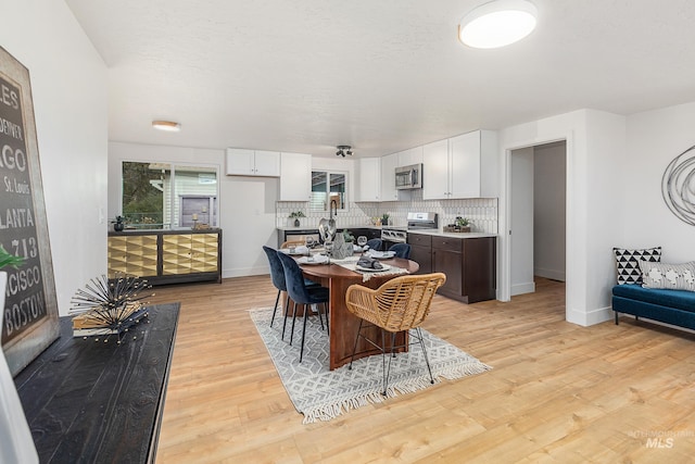 dining space featuring light hardwood / wood-style floors