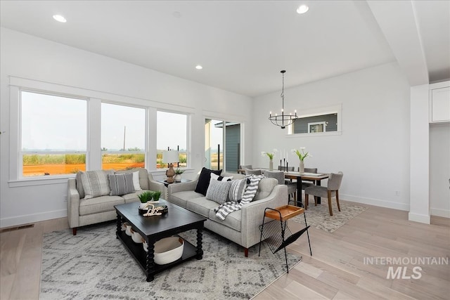 7625 W Whisper Ridge Dr, Meridian, ID 83646 - living area featuring a chandelier, light wood-style flooring, and recessed lighting