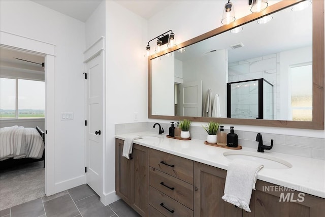 7625 W Whisper Ridge Dr, Meridian, ID 83646 - bathroom with double vanity, a stall shower, ensuite bathroom, and tile patterned flooring