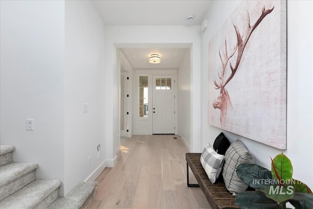 7625 W Whisper Ridge Dr, Meridian, ID 83646 - foyer featuring light wood-type flooring and stairs