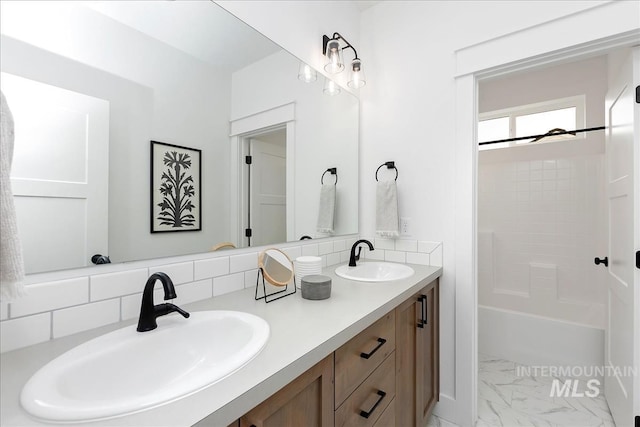 7625 W Whisper Ridge Dr, Meridian, ID 83646 - full bath with double vanity, marble finish floors, shower / tub combination, and backsplash