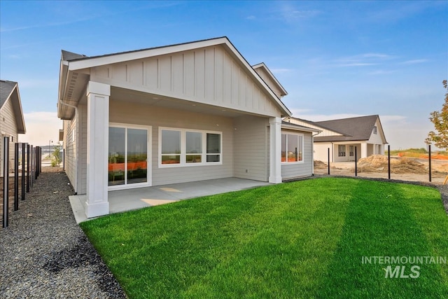 7625 W Whisper Ridge Dr, Meridian, ID 83646 - back of property with a patio and board and batten siding
