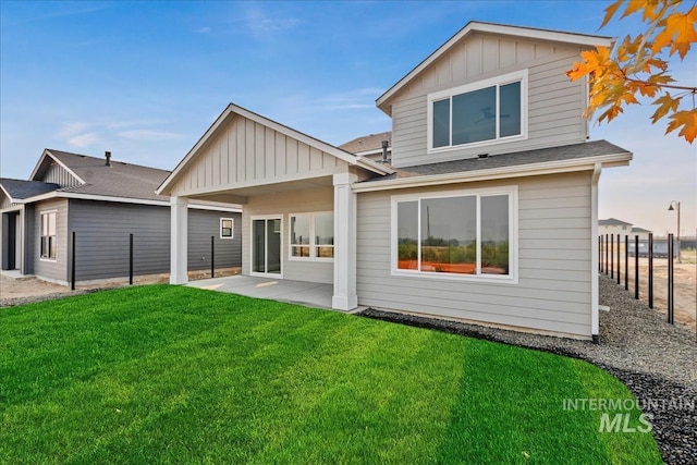 7625 W Whisper Ridge Dr, Meridian, ID 83646 - rear view of property featuring a patio area, board and batten siding, and roof with shingles