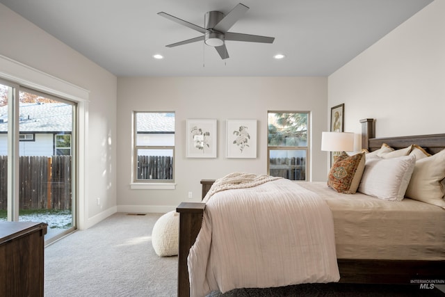 bedroom with access to exterior, light carpet, and ceiling fan