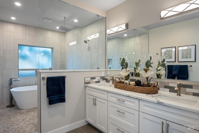 bathroom featuring vanity and shower with separate bathtub