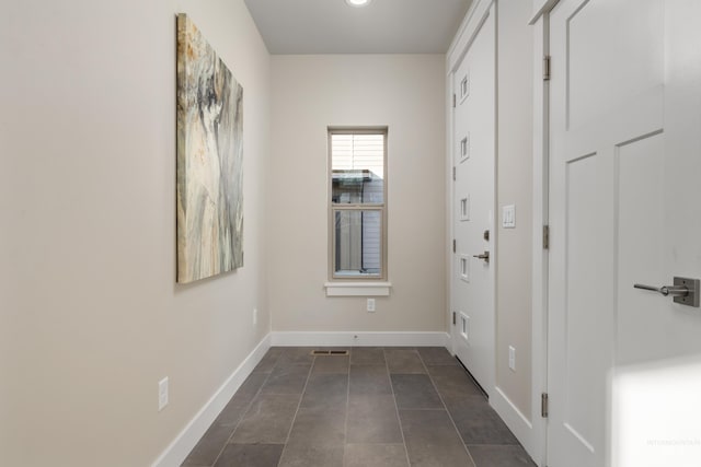 interior space with dark tile patterned floors