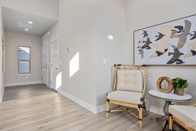 sitting room with light wood-type flooring