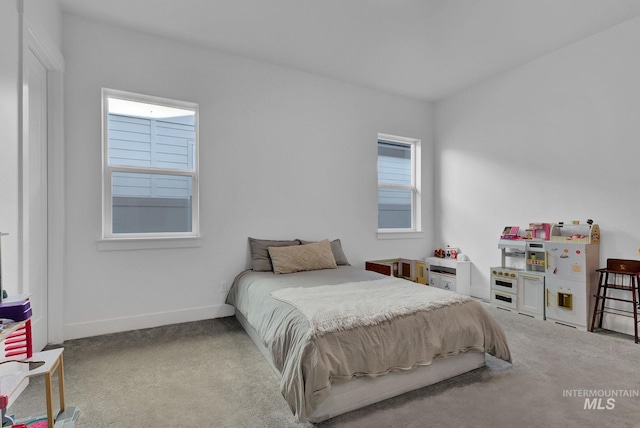 bedroom with light colored carpet