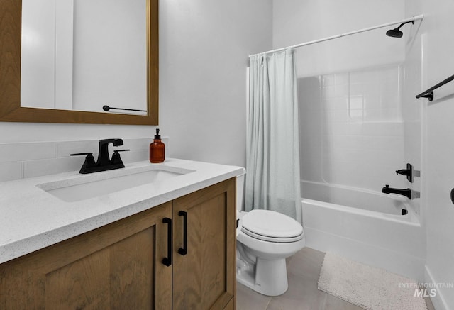 full bathroom featuring shower / tub combo with curtain, tile patterned floors, toilet, tasteful backsplash, and vanity