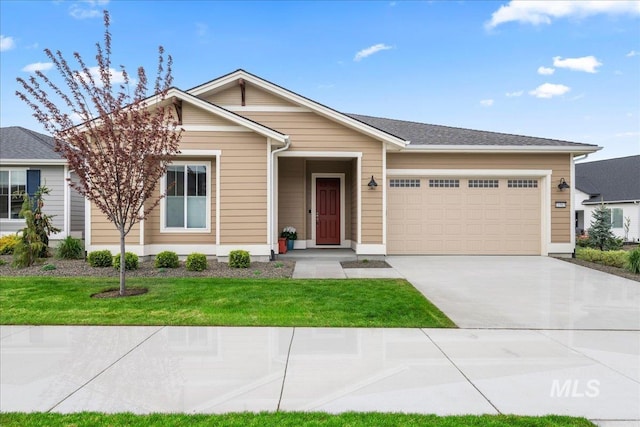11965 W Kind Ln, Kuna, ID 83634 - view of front facade with a front lawn, driveway, and an attached garage