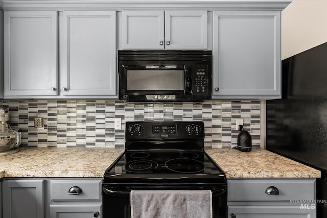 1814 N Rosedust Dr, Kuna, ID 83634 - kitchen featuring black appliances, backsplash, light countertops, and gray cabinetry