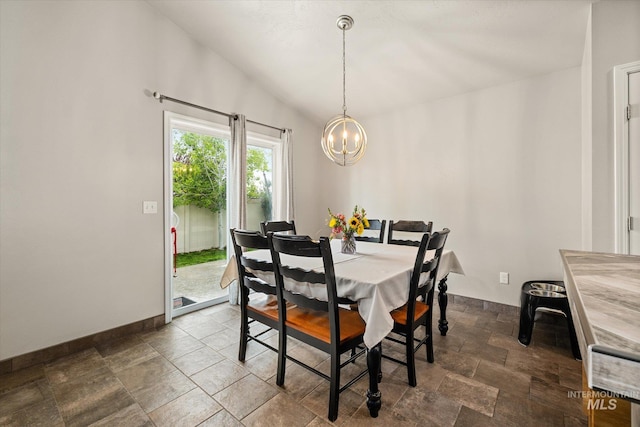 1814 N Rosedust Dr, Kuna, ID 83634 - dining space with a chandelier, dark stone finish floors, lofted ceiling, and baseboards