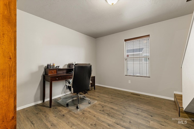 1814 N Rosedust Dr, Kuna, ID 83634 - home office with wood finished floors and baseboards