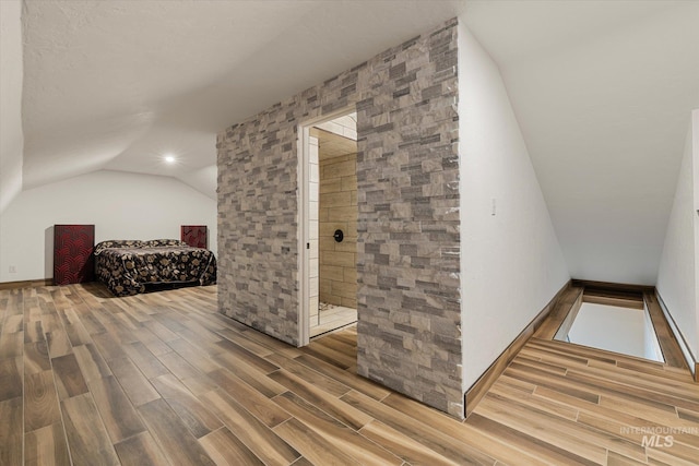 1814 N Rosedust Dr, Kuna, ID 83634 - additional living space with wood finished floors and lofted ceiling