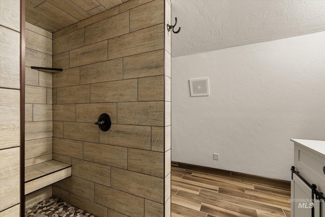 1814 N Rosedust Dr, Kuna, ID 83634 - full bath featuring wood finished floors, a tile shower, and vanity
