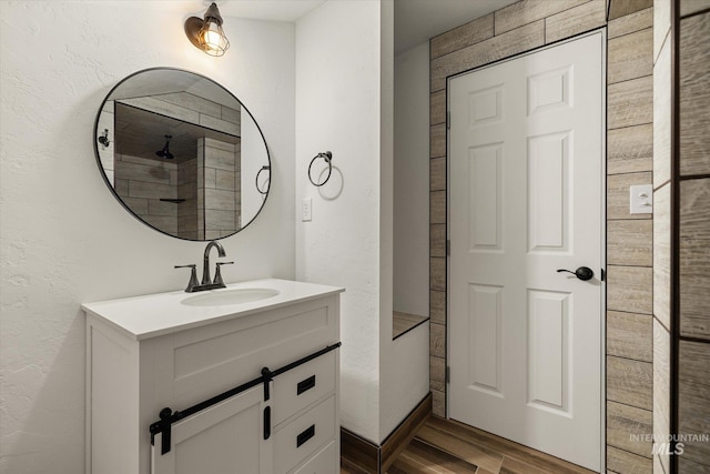 1814 N Rosedust Dr, Kuna, ID 83634 - bathroom featuring wood finished floors, vanity, and a textured wall
