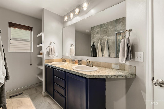 1814 N Rosedust Dr, Kuna, ID 83634 - full bathroom featuring double vanity, marble finish flooring, and baseboards