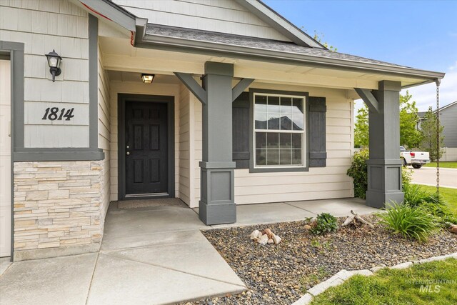 1814 N Rosedust Dr, Kuna, ID 83634 - view of exterior entry with a porch