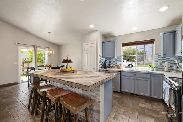 1814 N Rosedust Dr, Kuna, ID 83634 - kitchen featuring black range with electric stovetop, dishwasher, a sink, gray cabinets, and backsplash