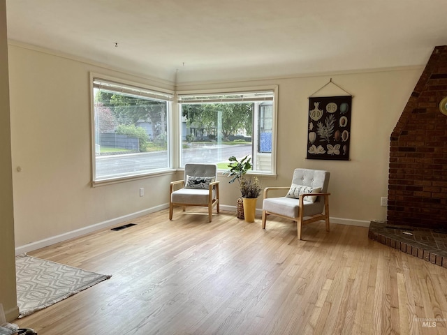1126 12th St, Clarkston, WA 99403 - sitting room with wood finished floors, plenty of natural light, and baseboards