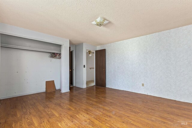 3709 11th St, Lewiston, ID 83501 - unfurnished bedroom featuring a textured ceiling, wood finished floors, and a closet