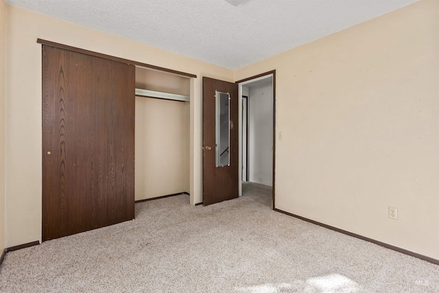 3709 11th St, Lewiston, ID 83501 - unfurnished bedroom with a textured ceiling, baseboards, carpet, and a closet