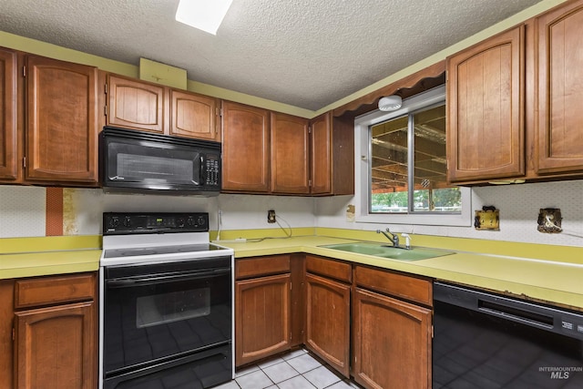 3709 11th St, Lewiston, ID 83501 - kitchen featuring a textured ceiling, a sink, light countertops, light tile patterned floors, and black appliances