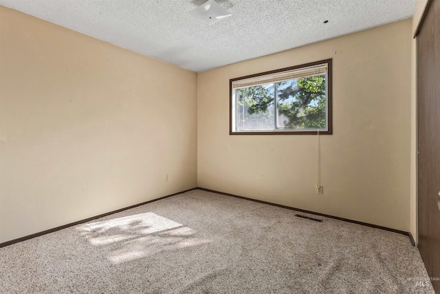 3709 11th St, Lewiston, ID 83501 - carpeted spare room with baseboards, a textured ceiling, and visible vents