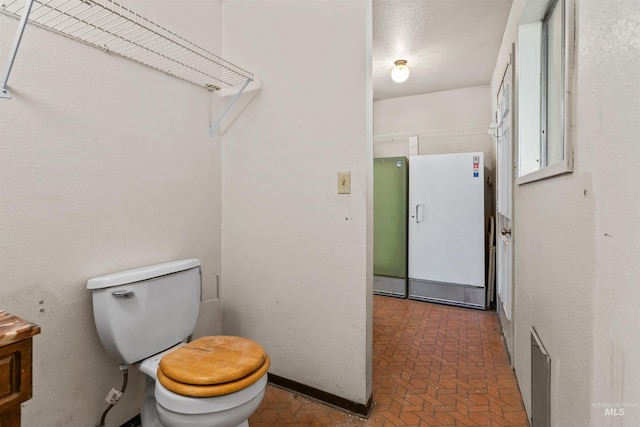 3709 11th St, Lewiston, ID 83501 - bathroom with brick floor and toilet