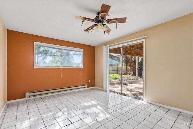 spare room featuring light tile patterned floors, baseboards, a baseboard radiator, and ceiling fan