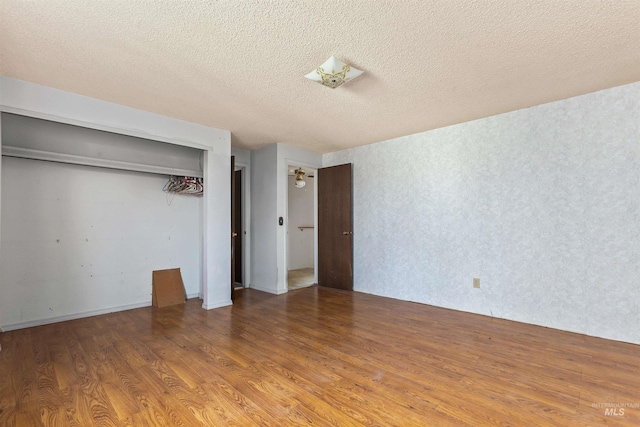 3709 11th St, Lewiston, ID 83501 - unfurnished bedroom featuring a textured ceiling, wood finished floors, and a closet