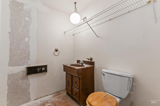 3709 11th St, Lewiston, ID 83501 - half bath featuring concrete flooring, toilet, and vanity
