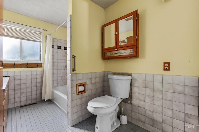 3709 11th St, Lewiston, ID 83501 - full bathroom featuring toilet, tile walls, shower / bathtub combination with curtain, a wainscoted wall, and tile patterned floors