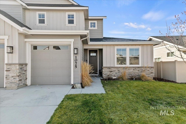 view of front facade with board and batten siding, stone siding, concrete driveway, and fence