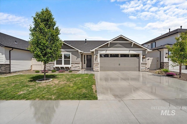 7682 W Itasco Dr, Boise, ID 83709 - craftsman-style house with a garage, stone siding, concrete driveway, and a gate