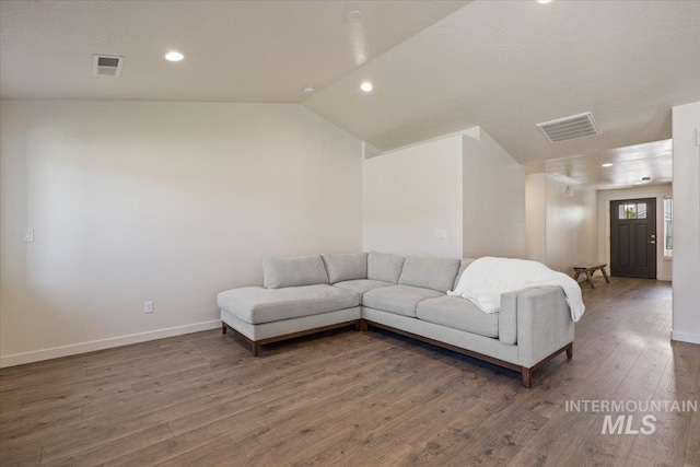 7682 W Itasco Dr, Boise, ID 83709 - living room with wood finished floors, baseboards, vaulted ceiling, and recessed lighting