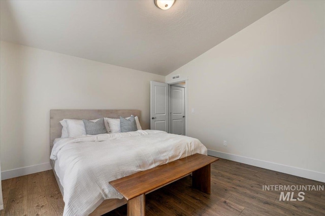 7682 W Itasco Dr, Boise, ID 83709 - bedroom featuring vaulted ceiling, baseboards, and wood finished floors