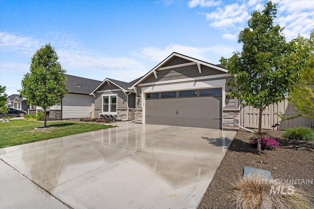 7682 W Itasco Dr, Boise, ID 83709 - view of front of property with stone siding, concrete driveway, a garage, and a front lawn