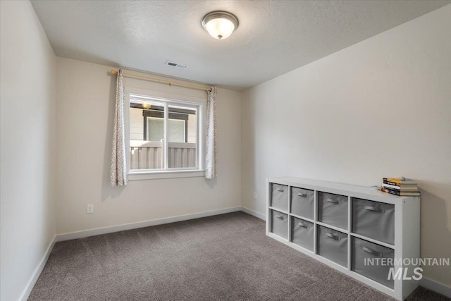 7682 W Itasco Dr, Boise, ID 83709 - unfurnished room with carpet floors, baseboards, and a textured ceiling