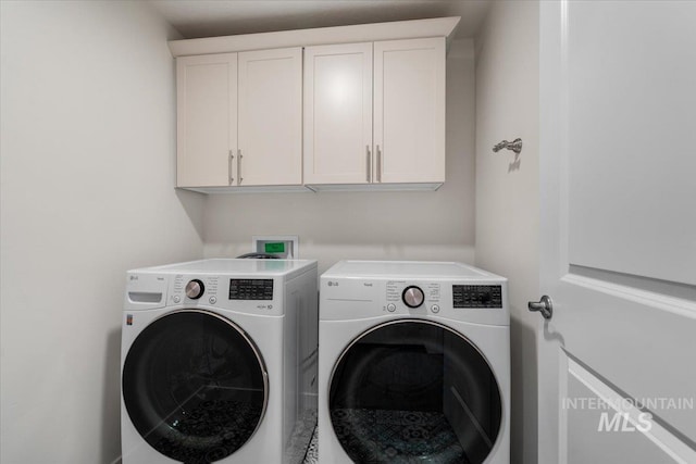 7682 W Itasco Dr, Boise, ID 83709 - laundry area featuring washing machine and dryer and cabinet space