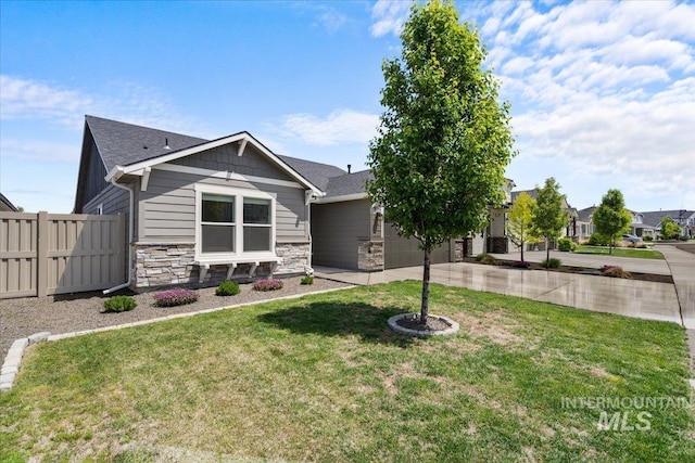 7682 W Itasco Dr, Boise, ID 83709 - view of front facade with stone siding, driveway, and a garage